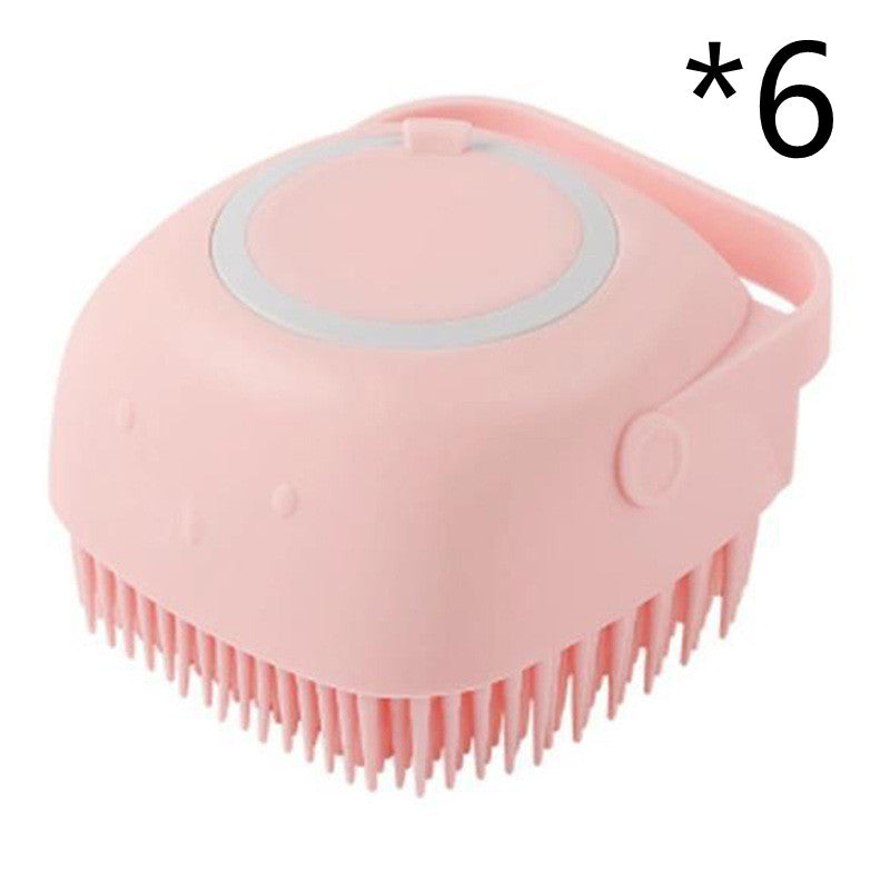 Pink silicone scrubber with bristles on a white background