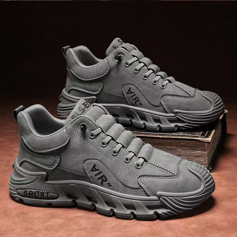 Gray sneakers with 'VIR' branding on a brown surface