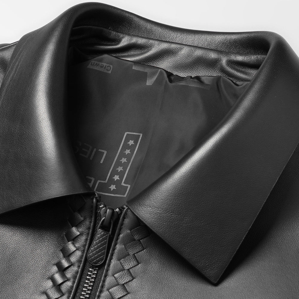 Close-up of a black leather jacket with a brand logo on the collar.