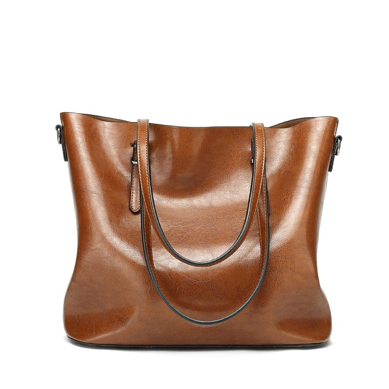 Women's retro oil wax leather tote bag in coffee brown, front view showing open top, dual handles and detachable crossbody strap