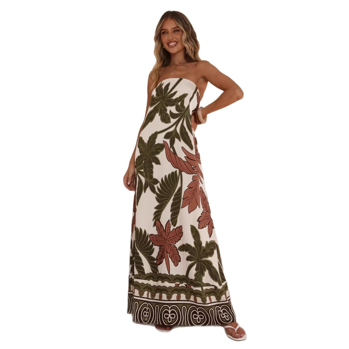 Woman wearing a strapless dress with floral pattern on a white background