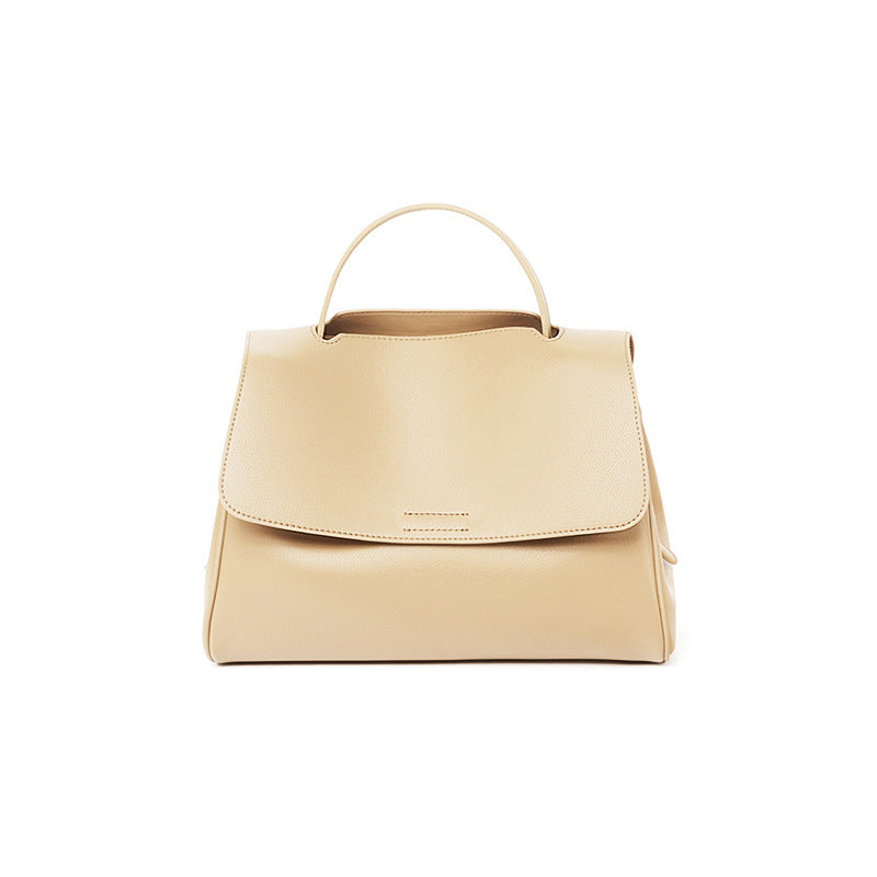Beige handbag on a white background