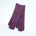 Pair of purple gloves on a light gray background