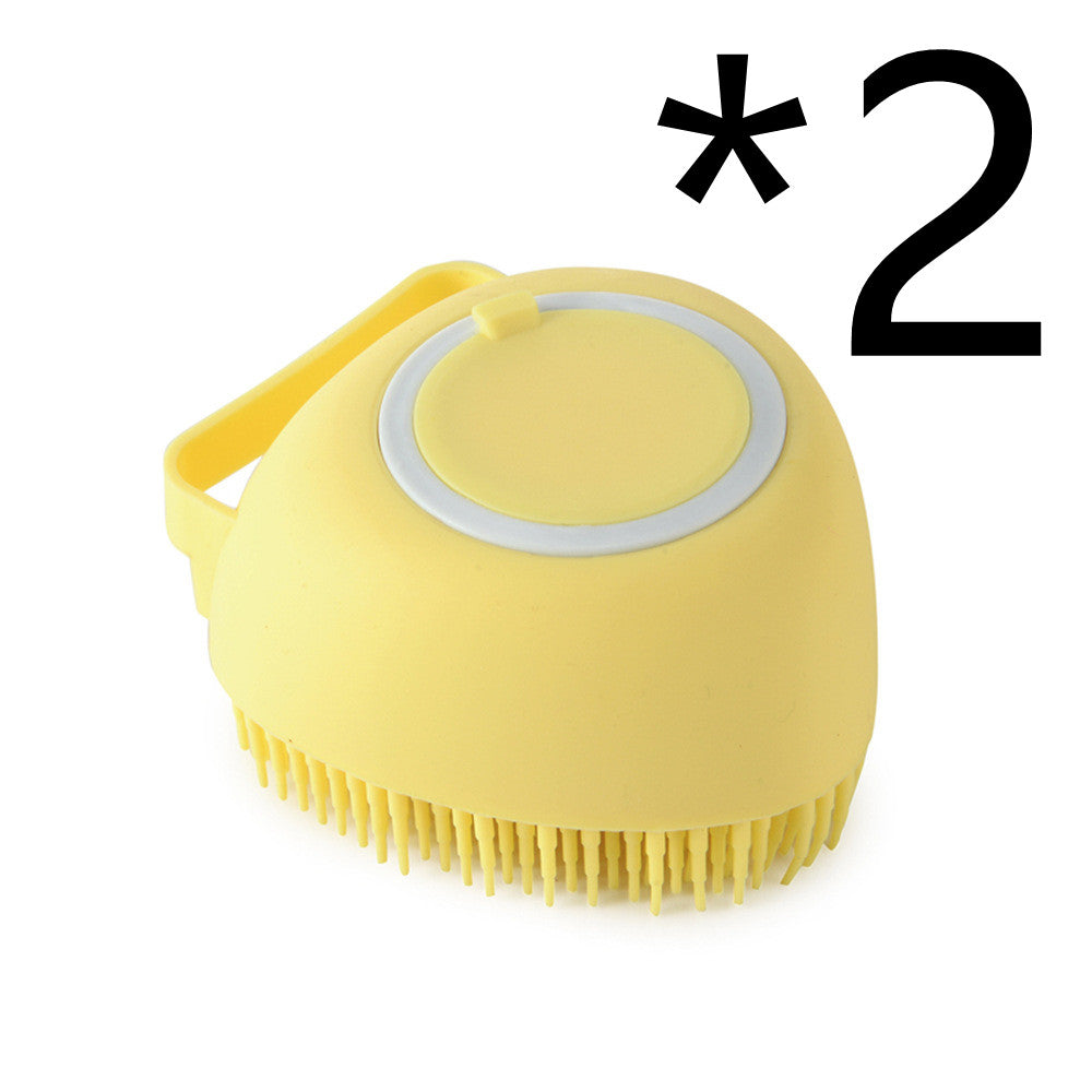 Yellow silicone scrubber with bristles on a white background