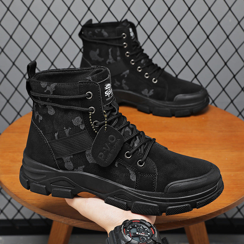 Black tactical boots on a wooden stool with a grid-patterned wall in the background