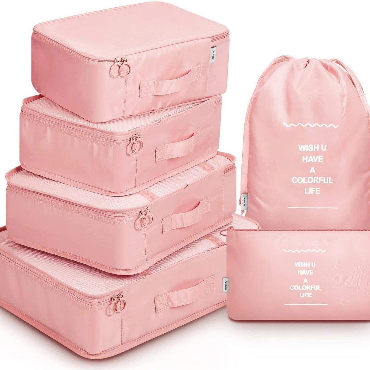 Set of pink packing cubes with a drawstring bag on a white background