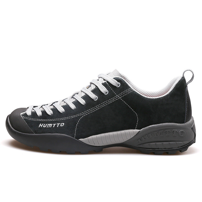 Black and gray sneaker with white laces on a white background