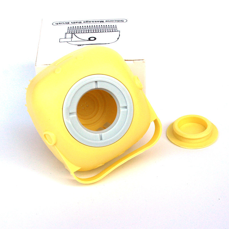 Yellow silicone massage ball with a white interior on a white background