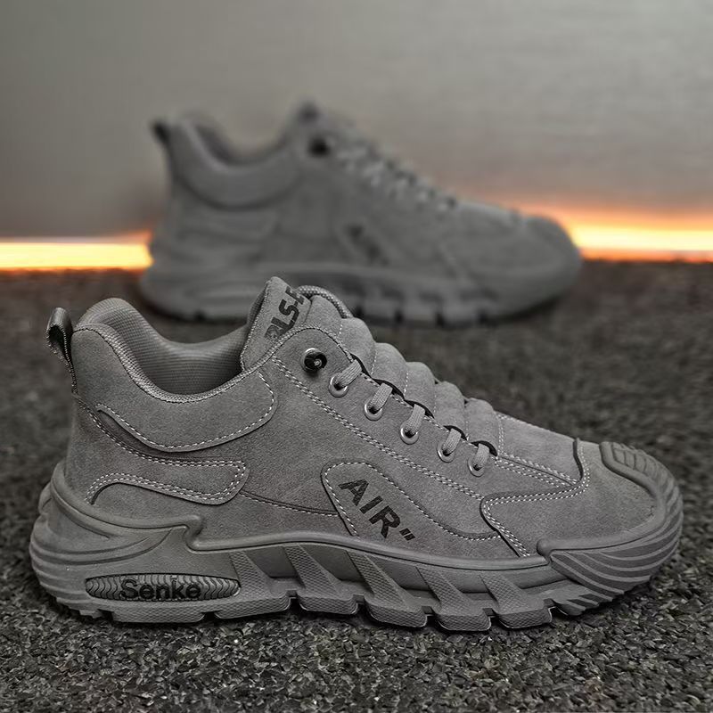 Gray sneakers with 'Air' branding on a textured surface
