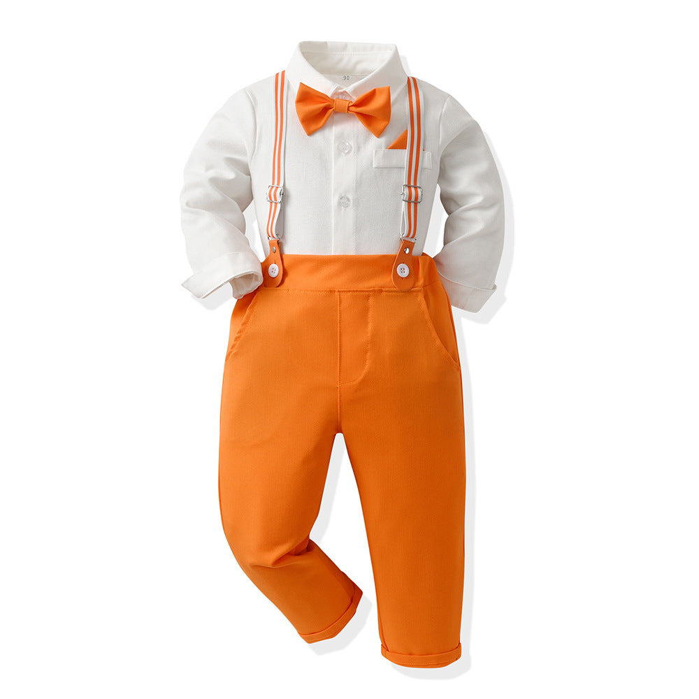 A baby boy's formal outfit consisting of a white long-sleeve shirt, bright orange suspenders, matching orange bow tie, and orange pocket square, displayed on a white background.