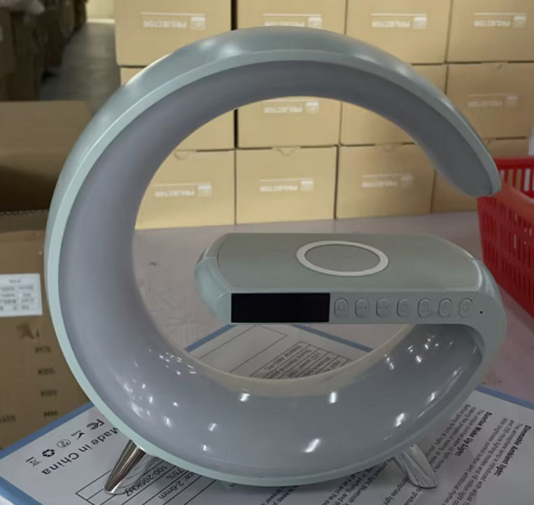 Round lamp with a stand on a surface with cardboard boxes in the background