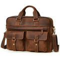 A brown distressed leather briefcase with dual top handles, a detachable shoulder strap, and multiple front utility pockets, photographed on a clean white background.