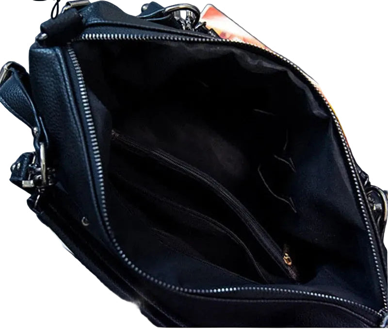 Black leather handbag with a visible brand name on a dark background