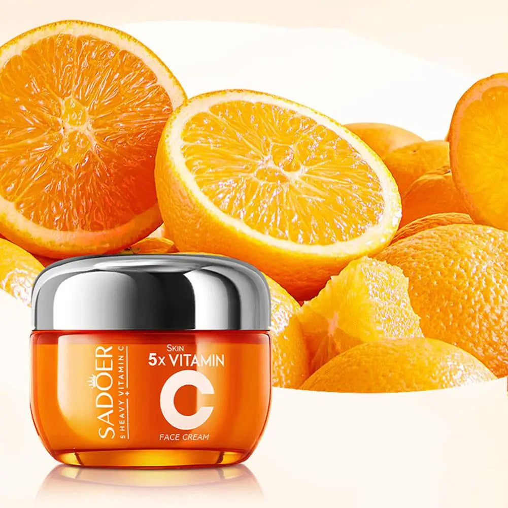 Sadoer Vitamin C face cream jar surrounded by sliced oranges on a light background