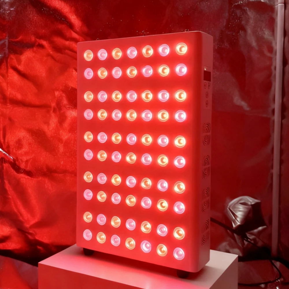 Red LED light panel on a stand with a red curtain background