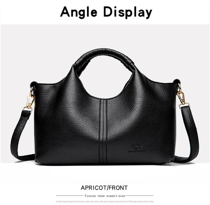 Black handbag with gold accents on a white background