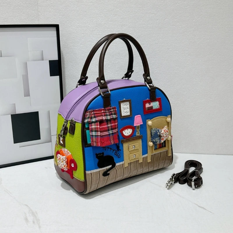 Colorful handbag with patchwork design on a white surface