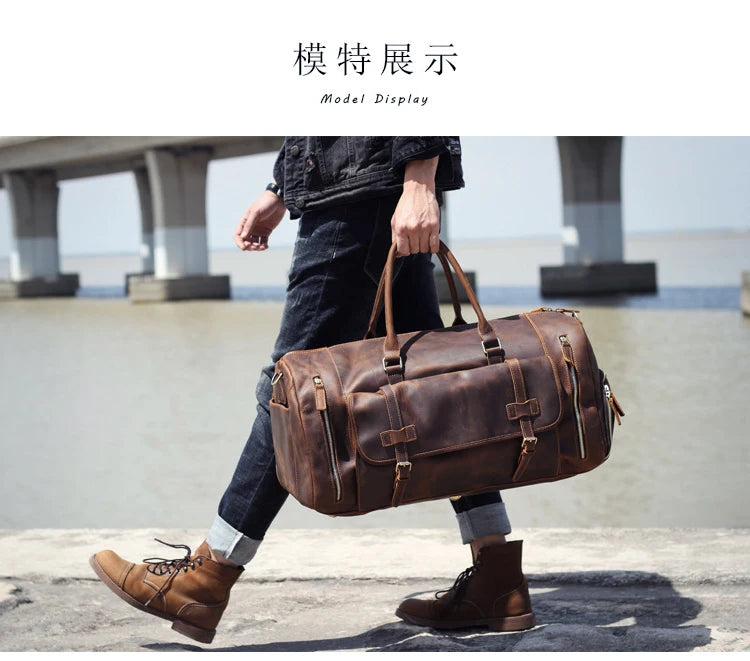 Person walking with a brown leather duffel bag on a concrete surface with a bridge in the background.