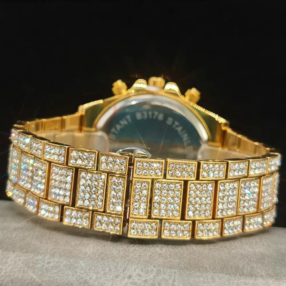 Gold watch with a diamond-studded band on a dark background