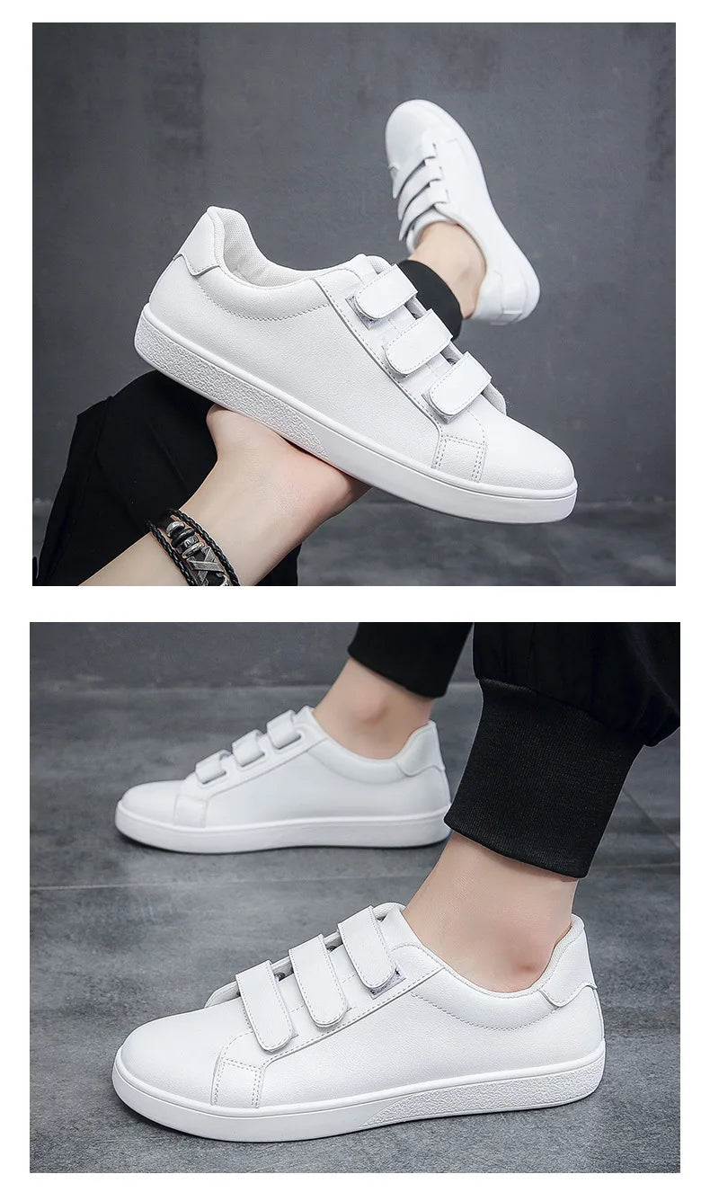 White sneakers with velcro straps worn by a person on a dark background