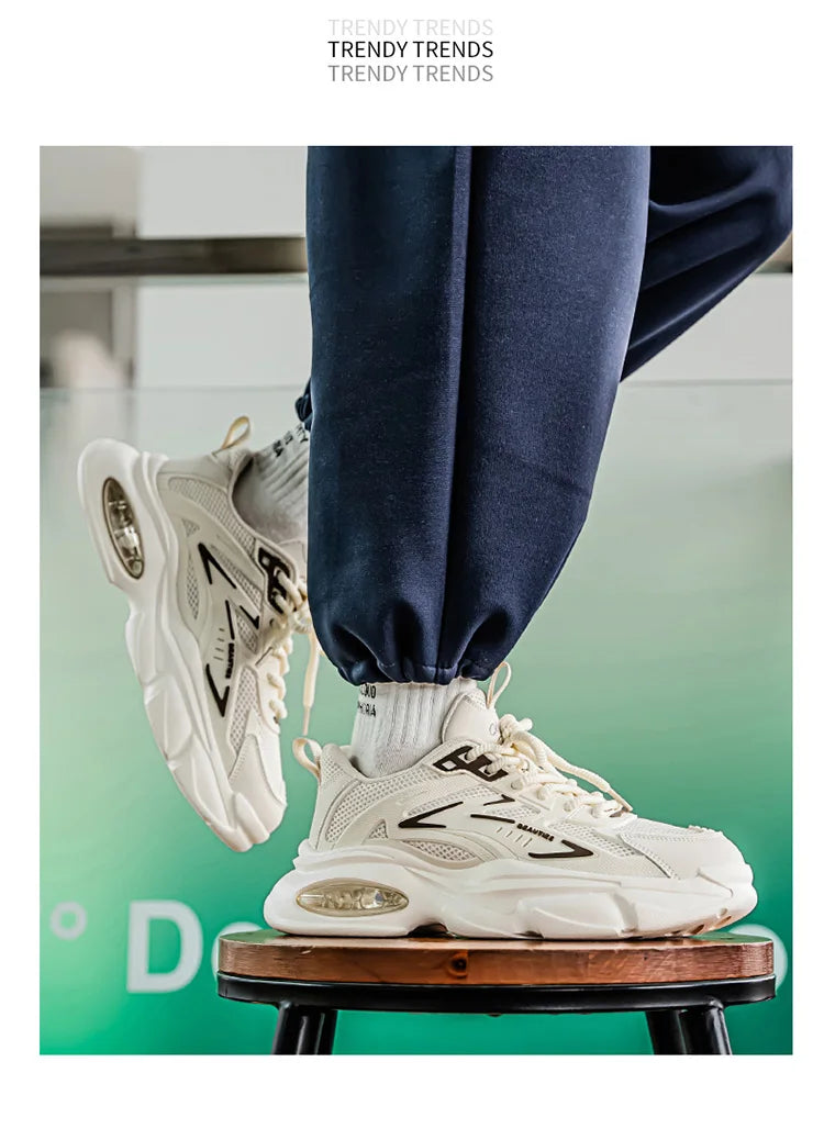 White sneakers with black accents worn by a person on a stool, with 'Trendy Trends' branding.