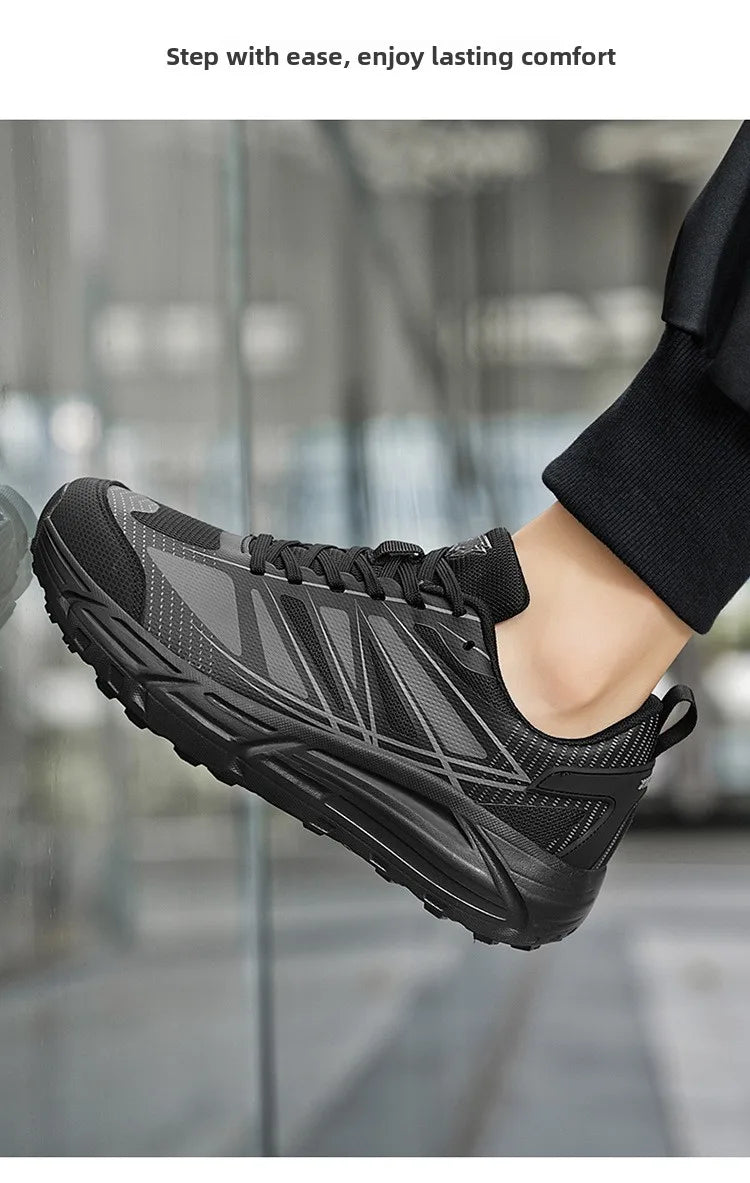 A black athletic sneaker with gray mesh panels and geometric side stripes, shown worn on a person's foot against a blurred glass-walled background. Text at the top reads, 'Step with ease, enjoy lasting comfort.