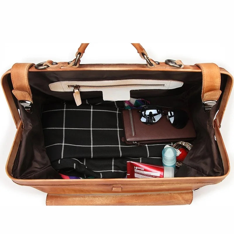 Open brown leather briefcase with items inside on a white background
