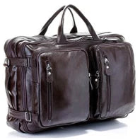 Brown leather travel bag with multiple zippers on a white background