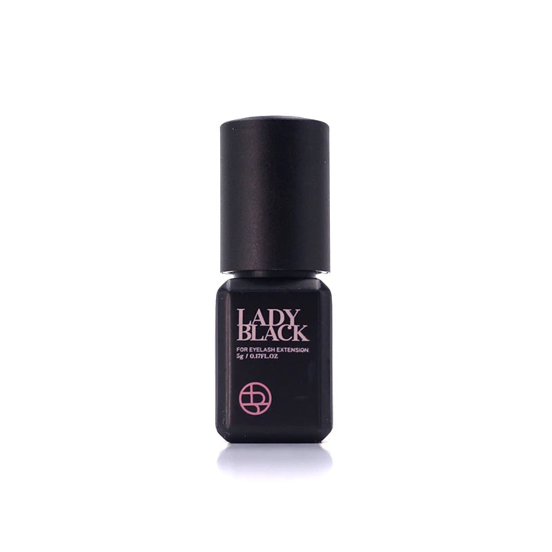 A bottle of Lady Black eyelash extension gel on a clean white background. The bottle is black with pink lettering and logo.