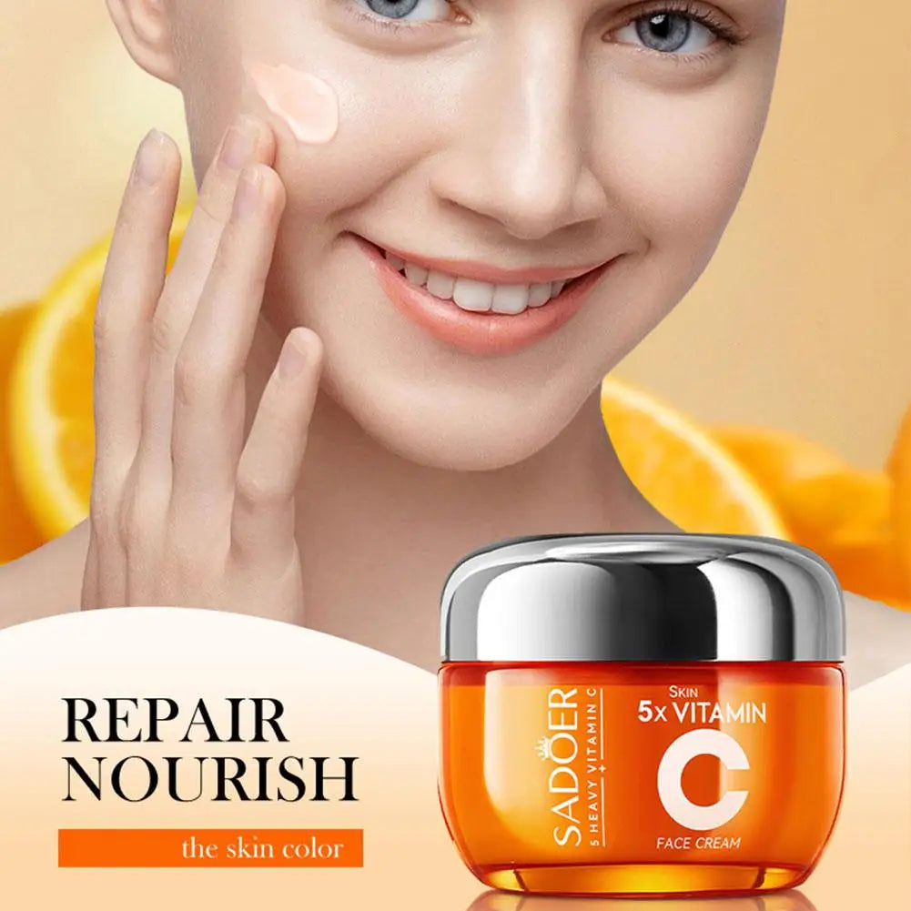 Woman applying cream to her face with a jar of SADOER Vitamin C face cream in the foreground.