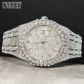 Silver diamond-encrusted watch on a dark background with 'UNIGUET' branding.
