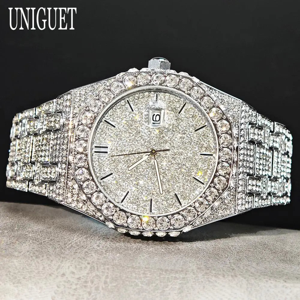 Silver diamond-encrusted watch on a dark background with 'UNIGUET' branding.