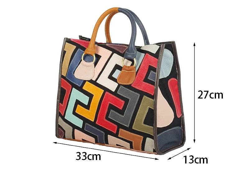 A multicolor geometric patchwork tote bag shown with dimension lines and labels indicating its measurements: 27cm height, 33cm width, and 13cm depth, on a plain white background.