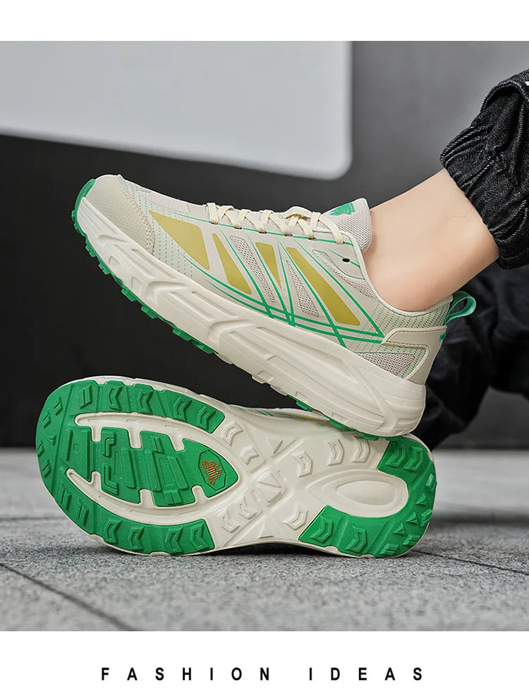 A pair of athletic sneakers shown on a person's foot and sole, with one shoe lifted to display the side and the other placed flat to show the treaded outsole. The shoes are off-white with bright green accents and a subtle yellow-green geometric pattern on the side.