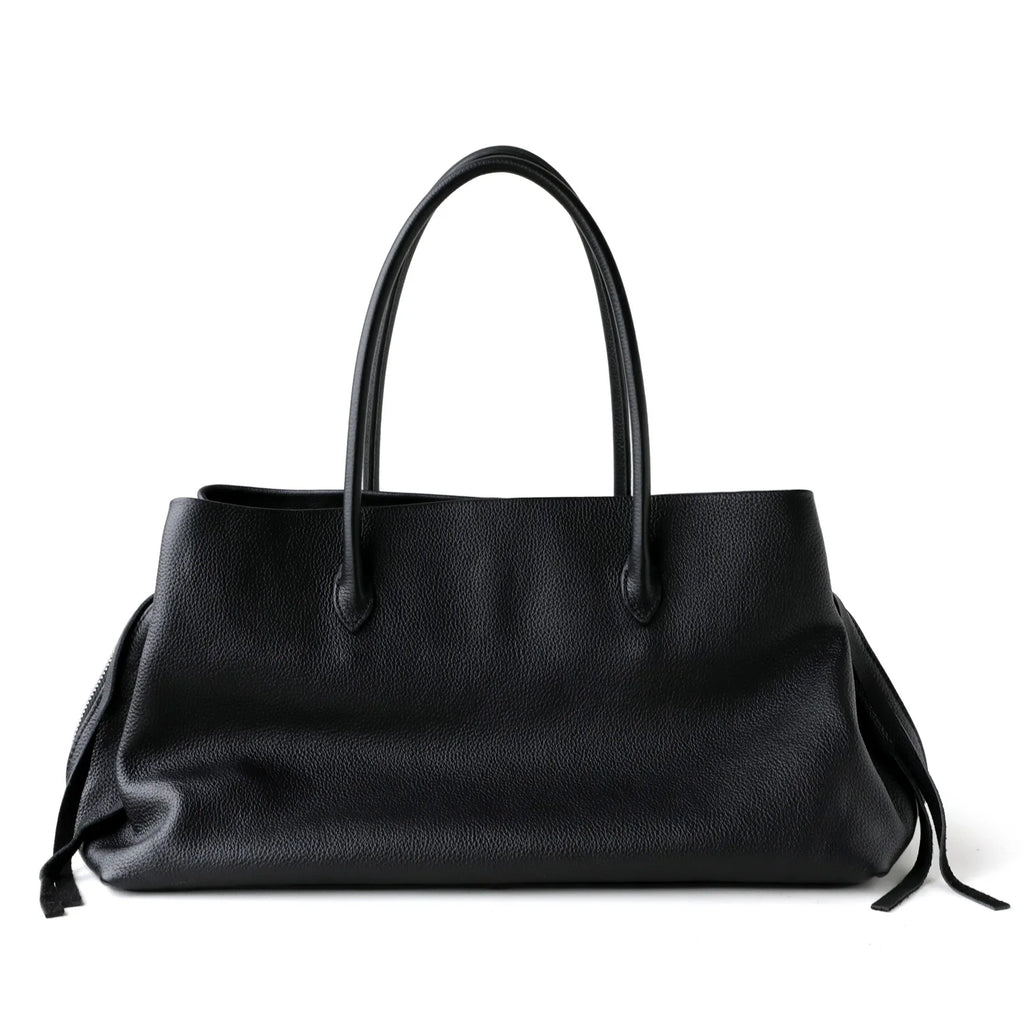 Black handbag with shoulder straps on a white background