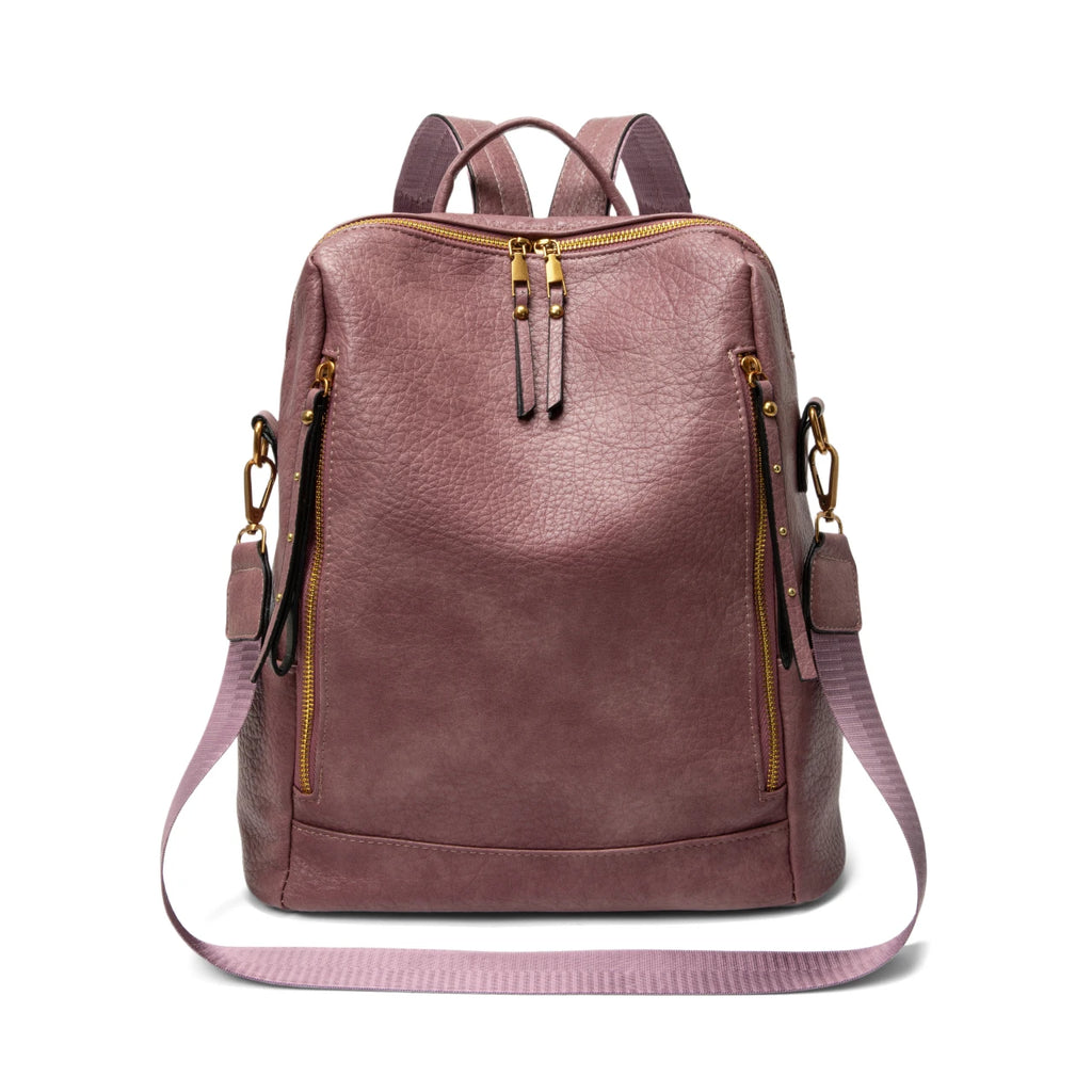 A dusty rose faux-leather backpack with gold-tone hardware, featuring a front zippered pocket, top zipper, dual top handles, and a detachable shoulder strap, shown against a plain white background.