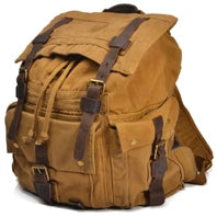 Brown backpack with leather straps on a white background