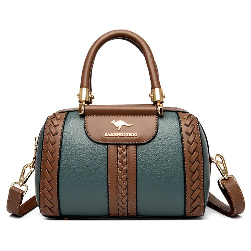 Brown and green handbag with braided details on a white background