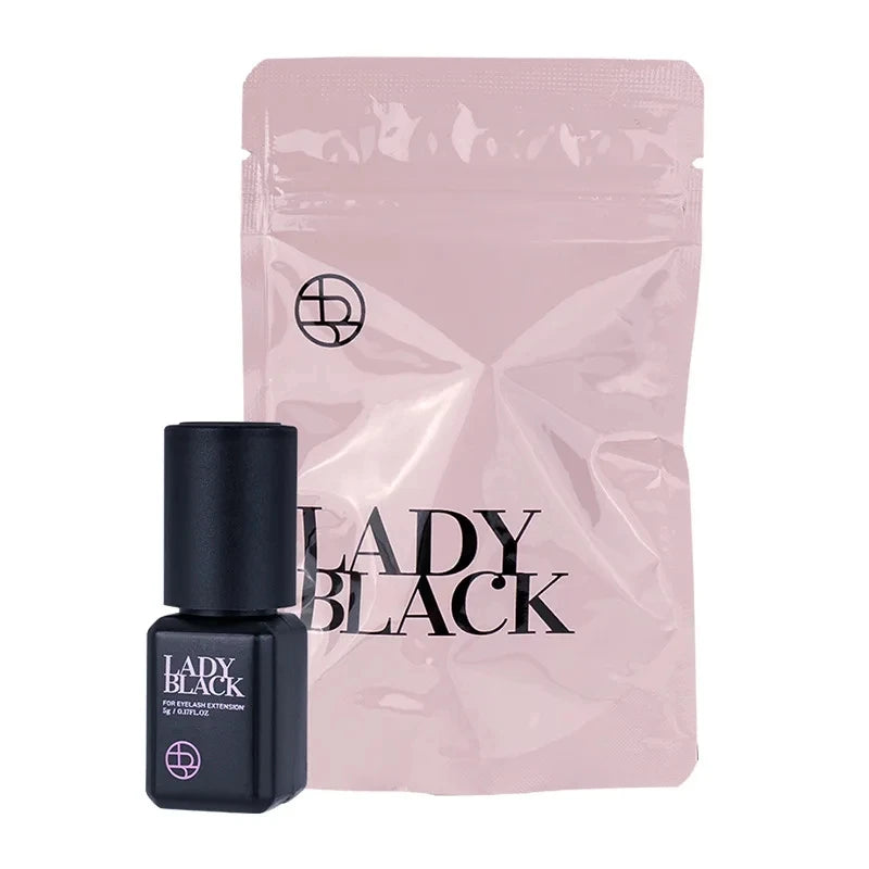 Black nail polish bottle and pink packaging with 'LADY BLACK' branding on a white background