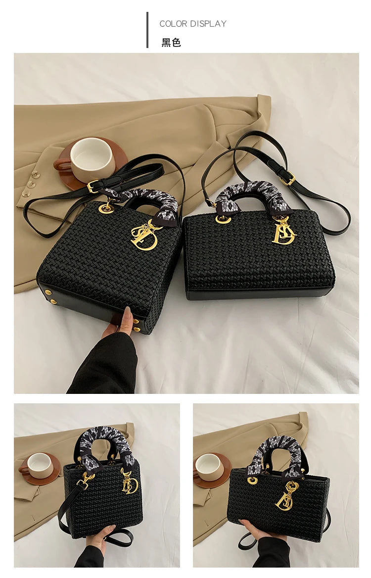 Black woven handbag with floral handle on a neutral background
