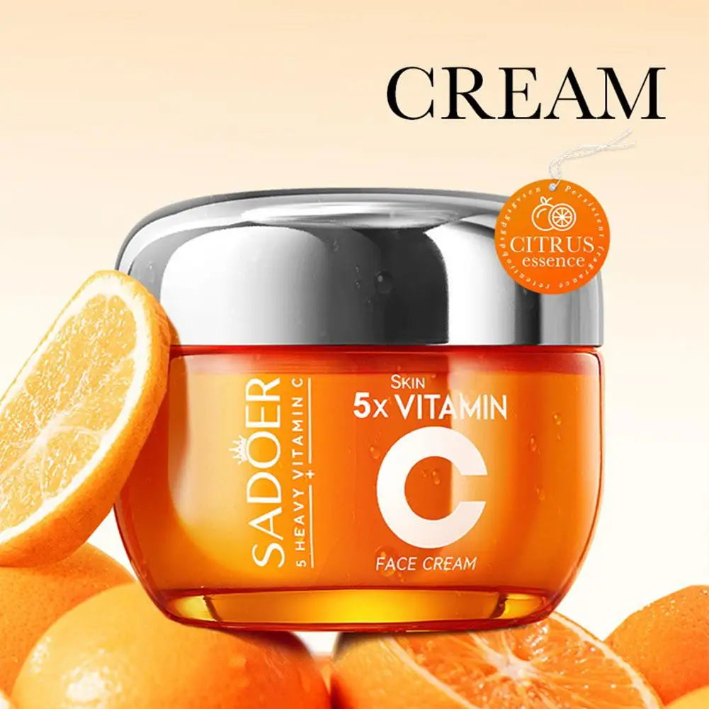 Orange skincare cream jar with oranges on a beige background