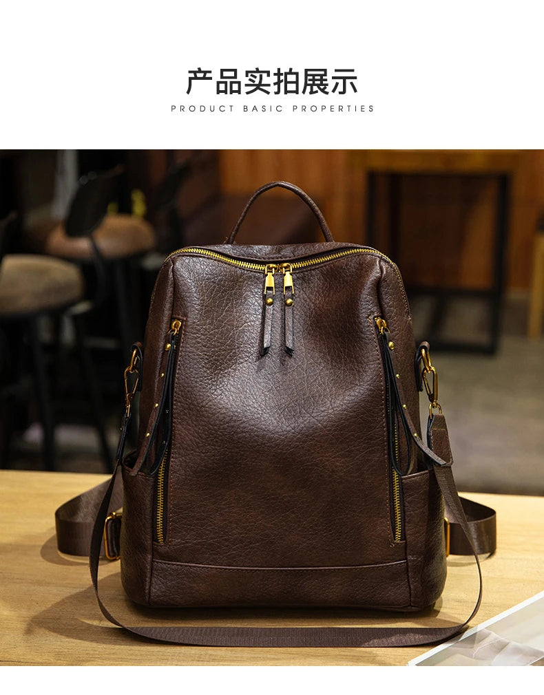 A dark brown textured leather backpack with gold-tone zippers and hardware, displayed on a wooden surface with a blurred indoor background. Chinese text and English 'PRODUCT BASIC PROPERTIES' appear at the top.