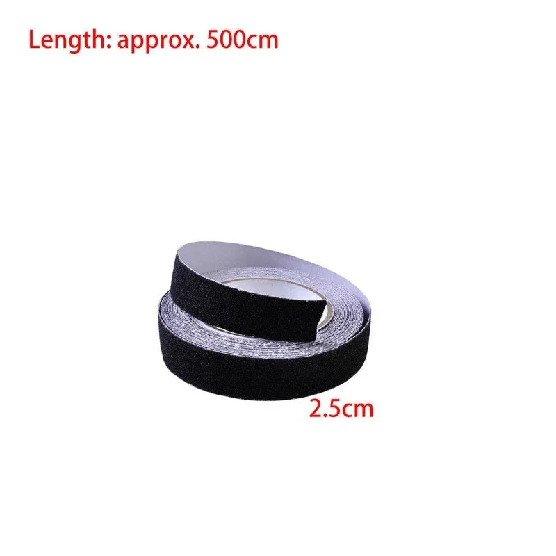 A roll of black adhesive tape with a textured grip surface and a silver backing, shown on a plain white background with red text indicating a length of approximately 500 cm and a width of 2.5 cm.