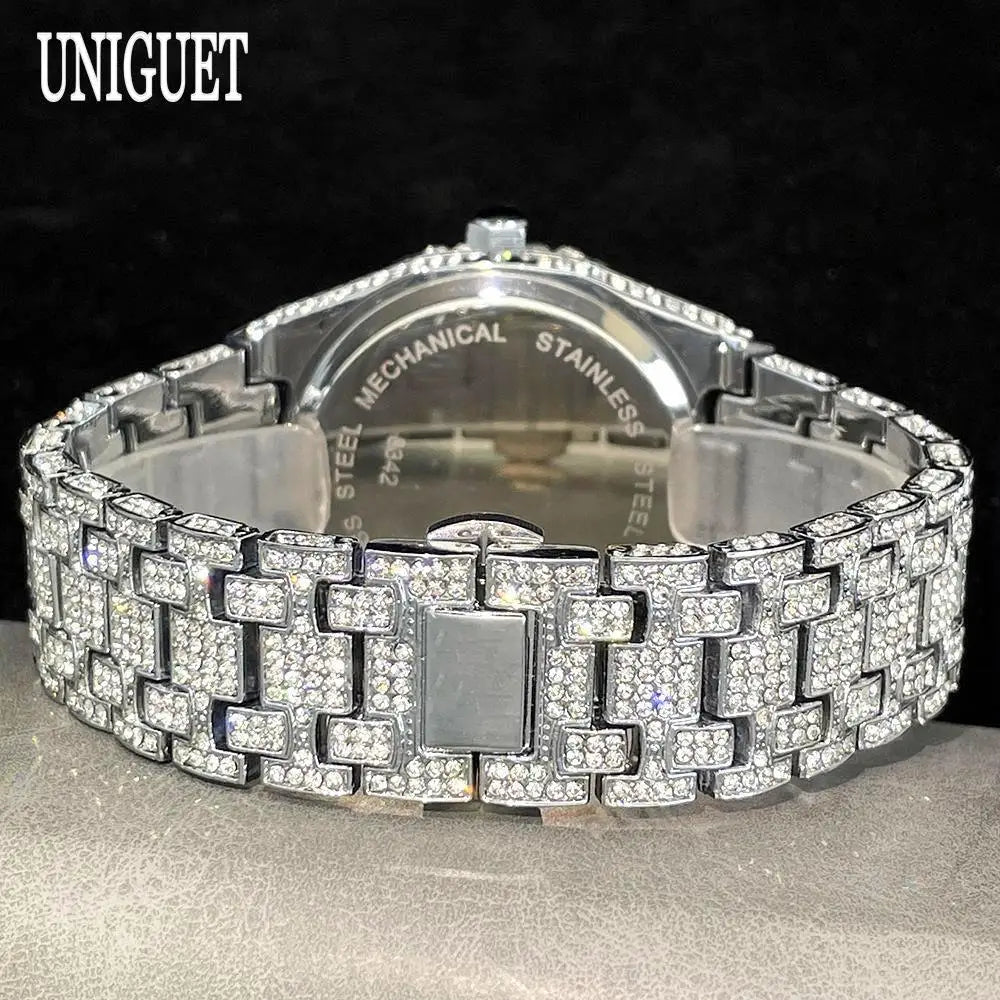 Silver bracelet with diamond accents on a dark background, branded 'UNIGUET'.
