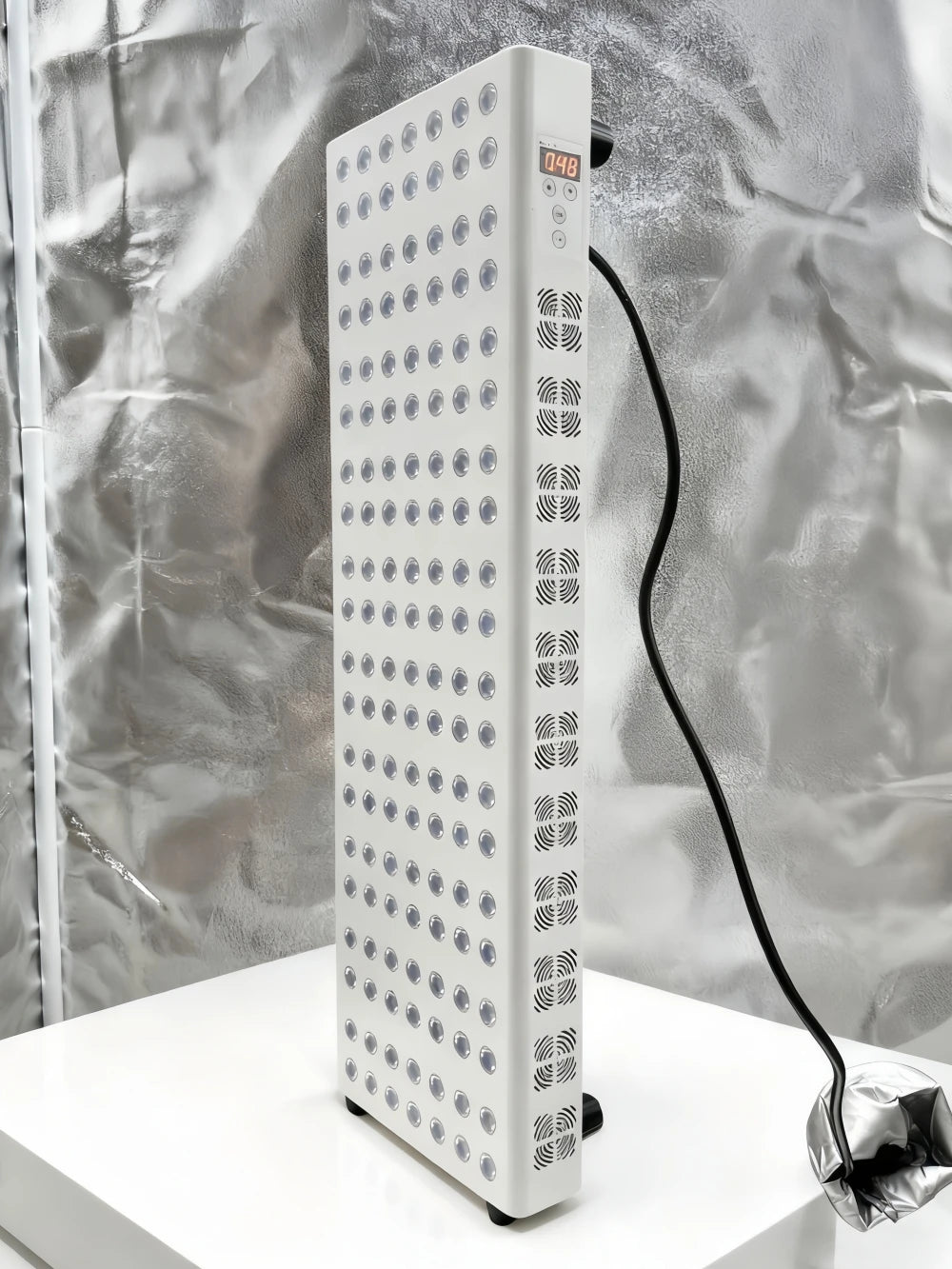 Tall rectangular device with a grid pattern on a reflective surface