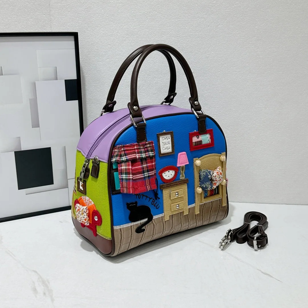 Colorful handbag with patchwork design on a white surface