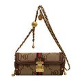 Designer handbag with chain strap on a white background