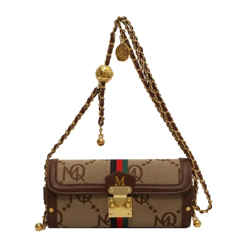 Designer handbag with chain strap on a white background
