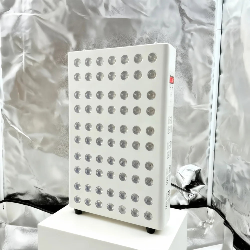 White electronic device with circular components on a white background