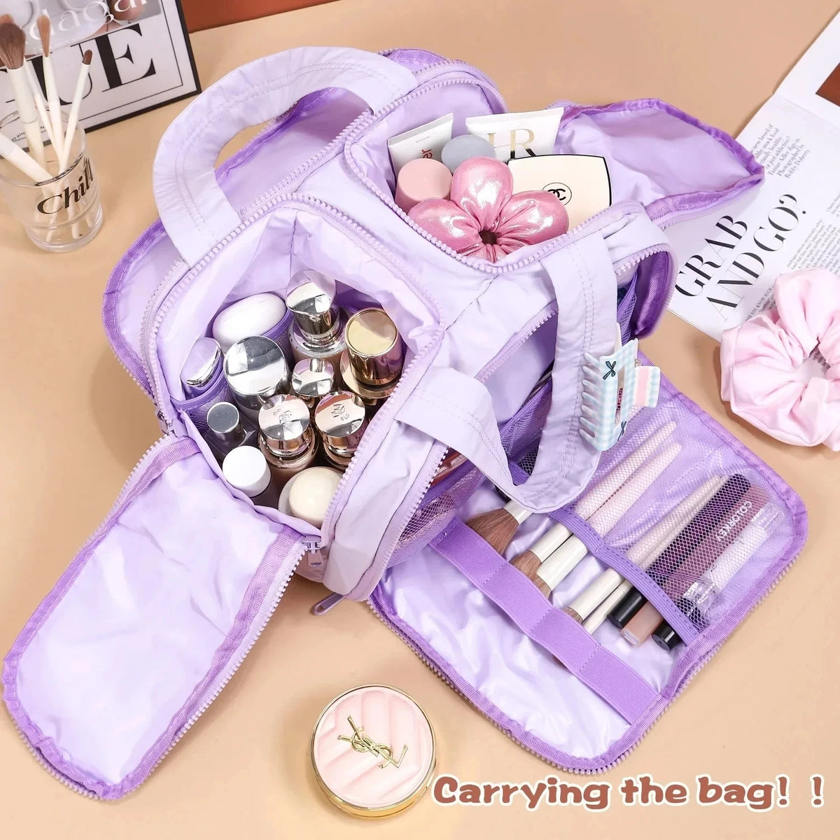 Purple cosmetic bag with makeup items on a beige surface